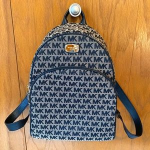 Michael Kors MK back pack with gold zippers and Sid pockets